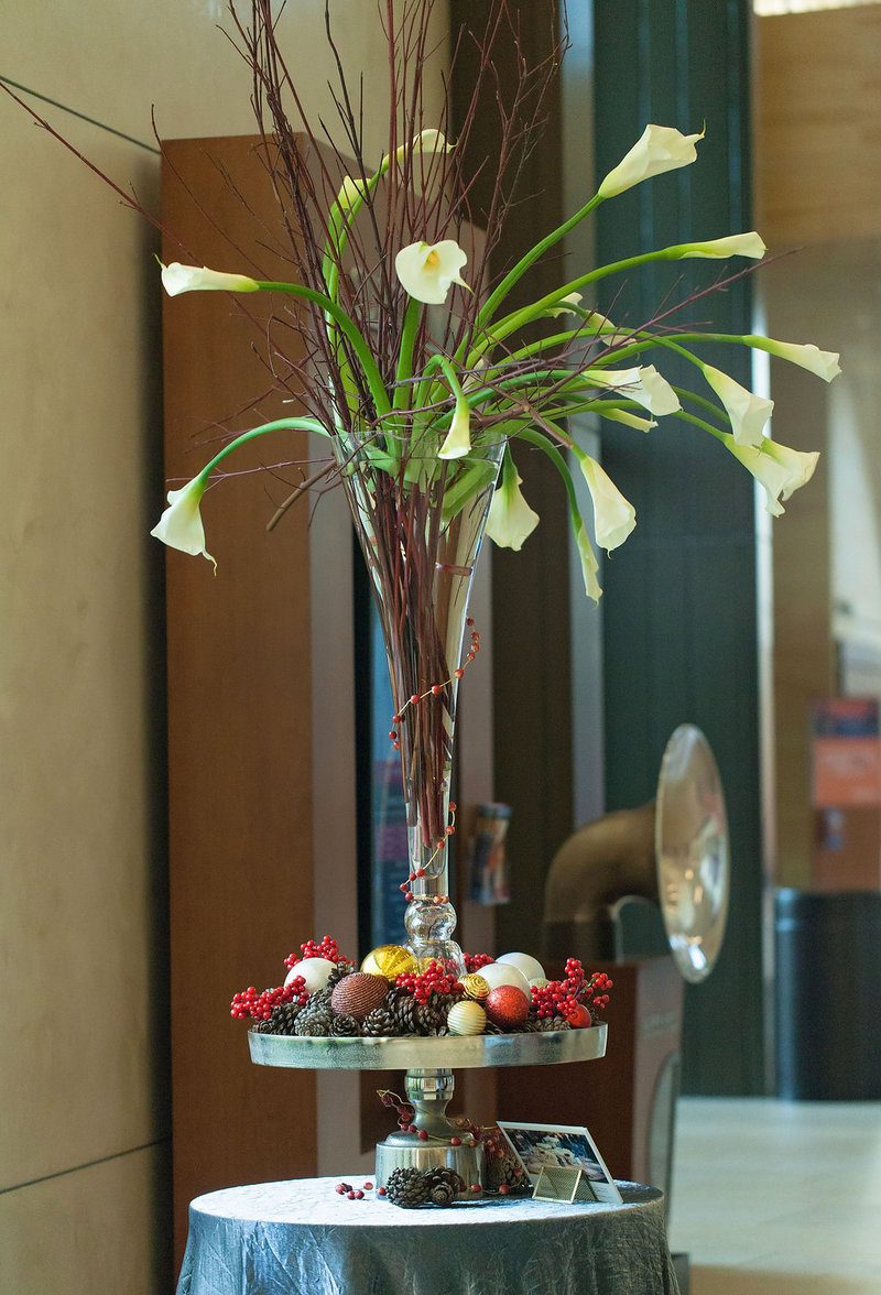 Elegant floral arrangement with decorative accents.