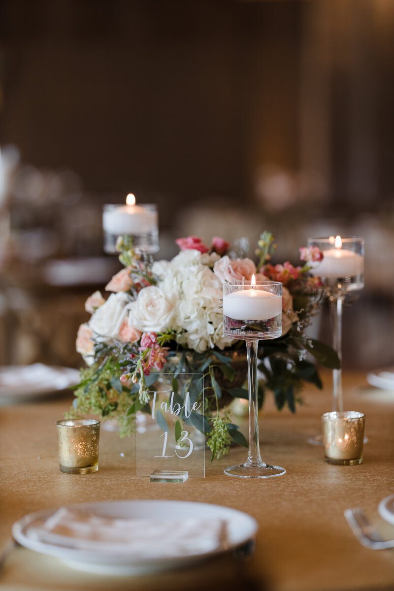 Elegant table setting with floral centerpiece.