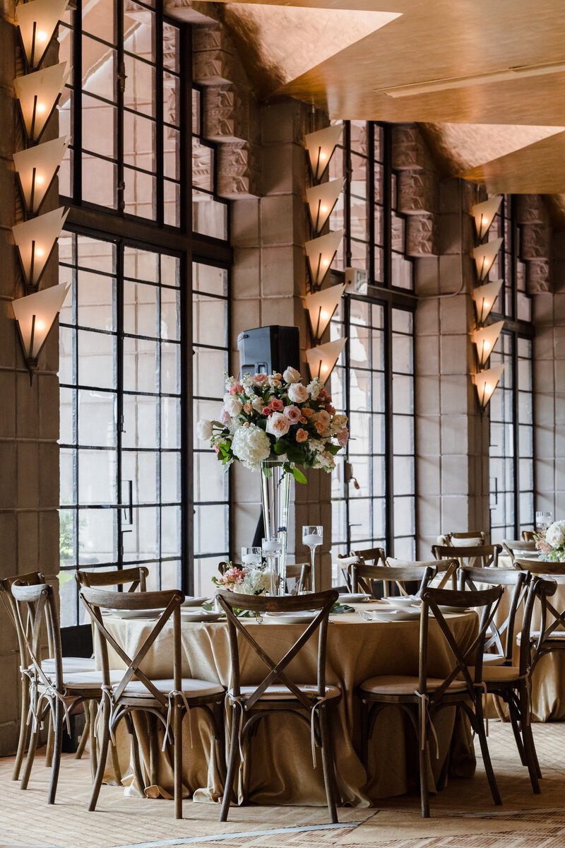 Elegant dining setup with floral centerpiece.
