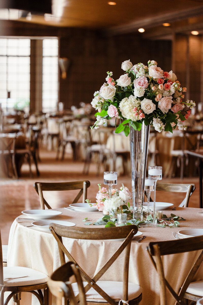 Elegant table setting with floral centerpiece.
