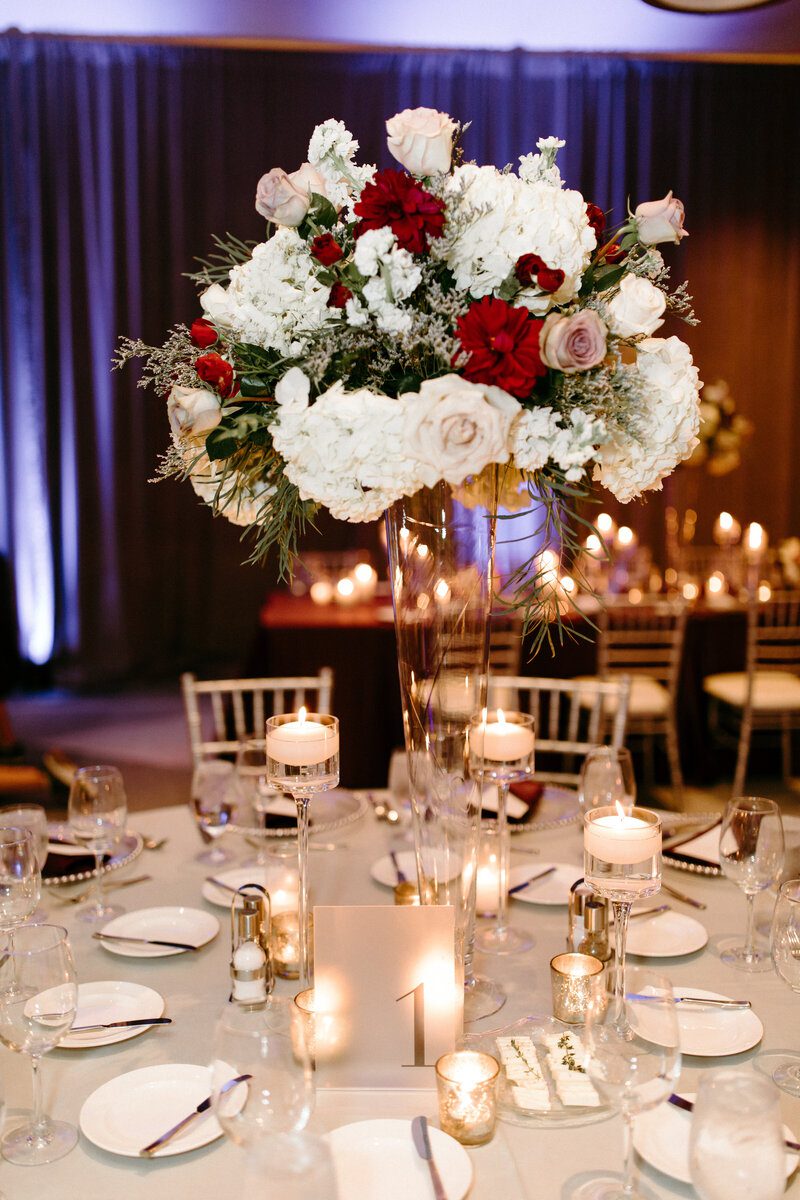 Elegant wedding table with floral centerpiece.